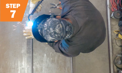 step 7: overhead view of welder welding